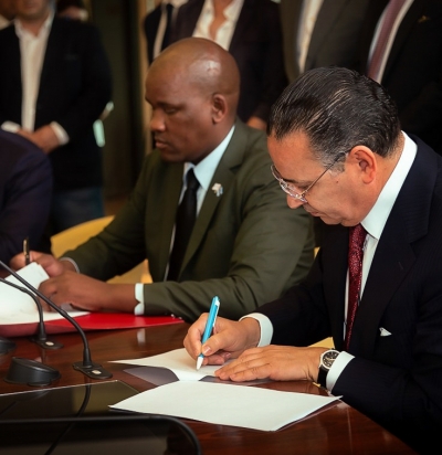 Chairman Kamel Ghribi; Alfred Madigele, Minister of Health and Wellness, Botswana. Signing a strategic co-ordination and co-operation partnership between Europe and Africa.